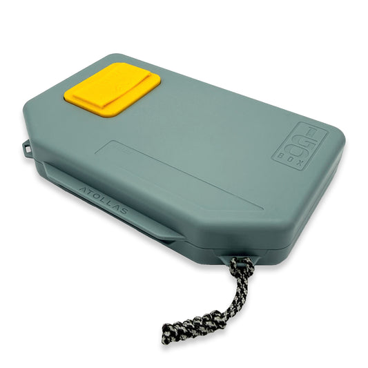 Light green 1GO Fly Box with yellow docking station against a white background