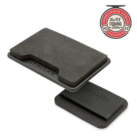 Atollas Fly Caddy fly patch hovering over an included docking station it clips into against white background